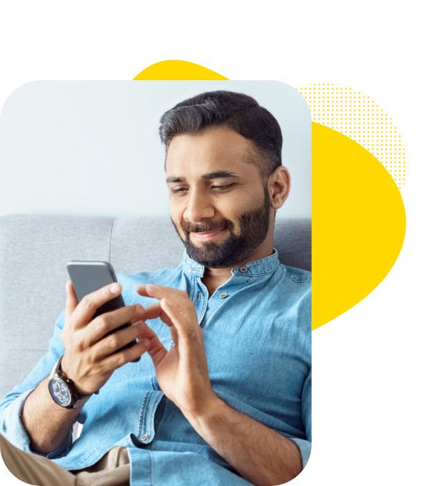 A patient looking at his phone for a telemedicine video consultation.
