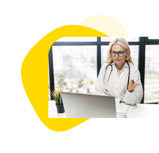 Doctor providing telemedicine services from a computer