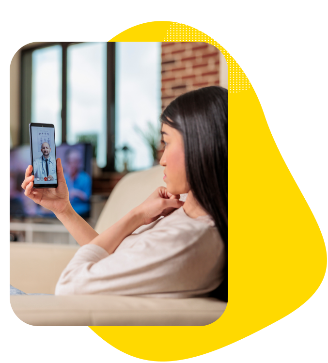 A young woman using her phone for a telemedicine doctor consultation.
